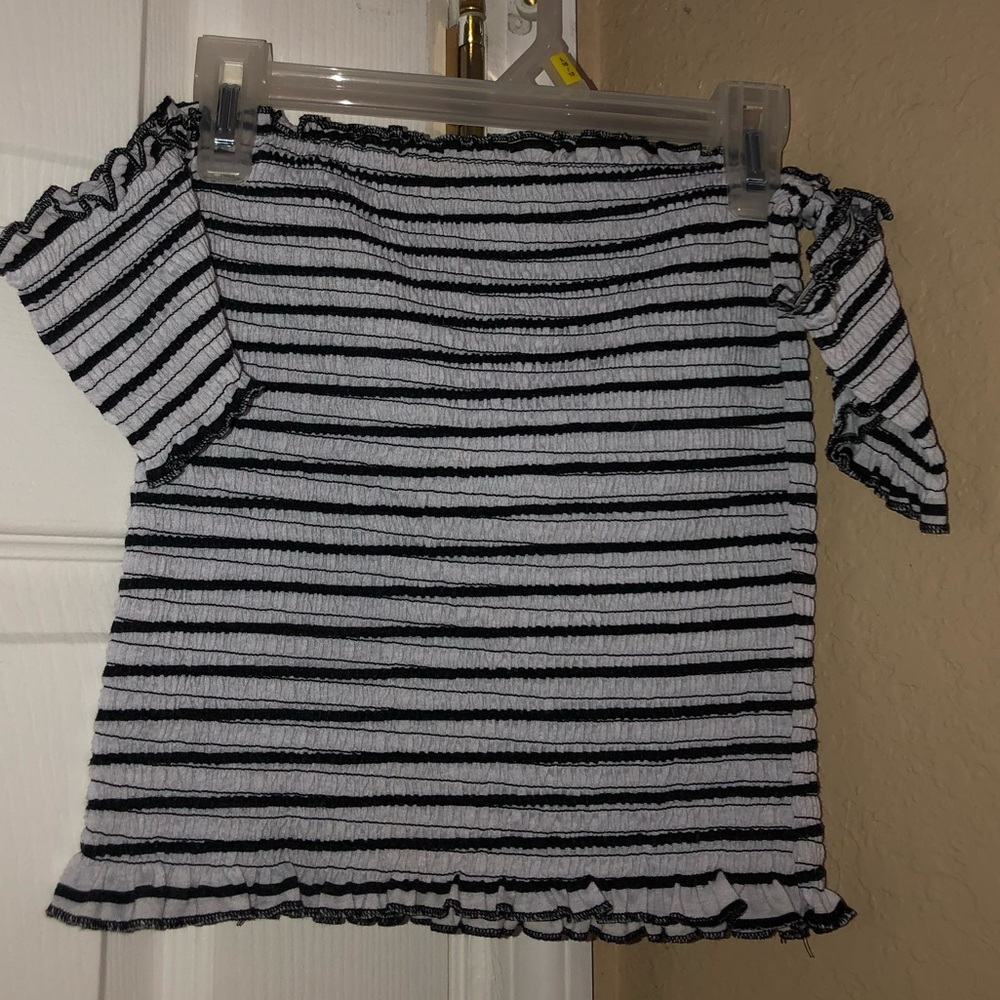 White and black striped off the should top